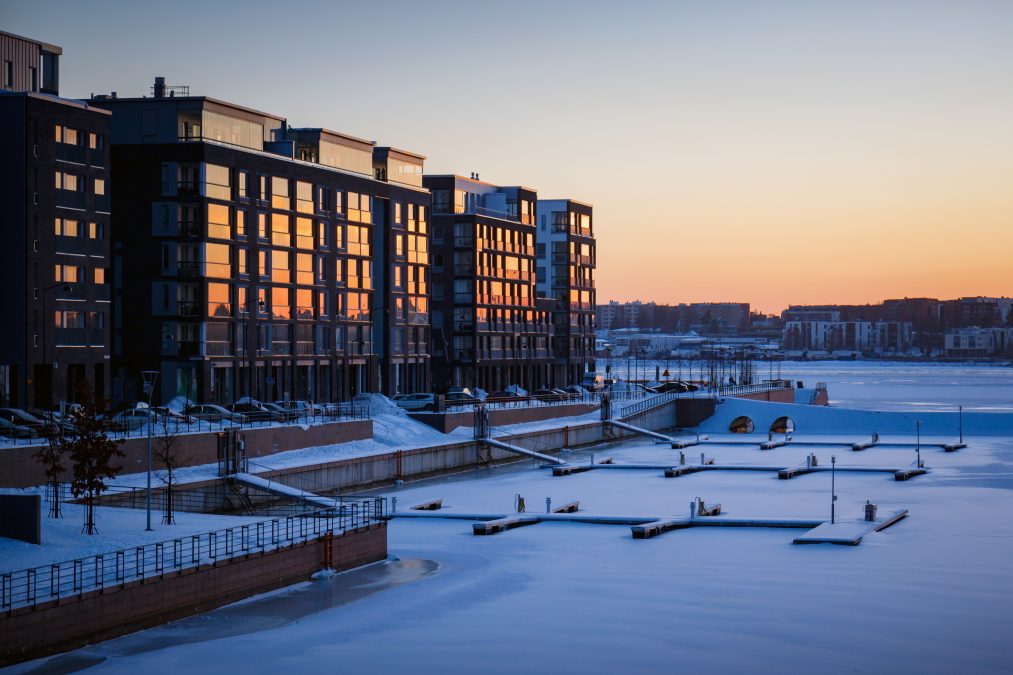 Apartment building windows reflecting sunset in winter
