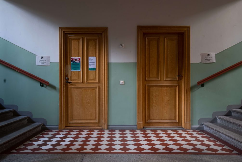 Two doors inside the corridor of a residential building